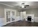 Living room with hardwood floors, fireplace and French doors at 4541 Hall Dairy Rd, Claremont, NC 28610