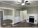 Bright living room with hardwood floors, fireplace, and ceiling fan at 4541 Hall Dairy Rd, Claremont, NC 28610