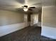 Bright upper hallway with ceiling fan and doors to bedrooms at 4541 Hall Dairy Rd, Claremont, NC 28610