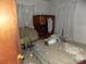 Bedroom with damaged mattress and debris on floor at 523 Hoyle St, Dallas, NC 28034