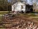 Side yard with debris and scattered bricks at 523 Hoyle St, Dallas, NC 28034