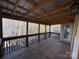 Screened-in porch overlooking wooded area at 7324 Leharne Dr, Charlotte, NC 28270