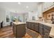 Modern kitchen with island, gray cabinets, and stainless steel appliances at 9717 Willow Leaf Ln, Cornelius, NC 28031