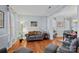 Living room with hardwood floors and neutral color palette at 10232 Squires Way, Cornelius, NC 28031