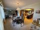 Bright dining area with table and chairs, open to the kitchen and living room at 121 48Th Ne Ave, Hickory, NC 28601