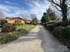 Long driveway leading to a brick ranch home with landscaping at 121 48Th Ne Ave, Hickory, NC 28601