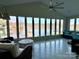 Sunroom with wall-to-wall windows overlooking lake at 121 48Th Ne Ave, Hickory, NC 28601