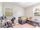Bright bedroom with two windows, a small seating area and home office at 1314 Frederick St, Shelby, NC 28150