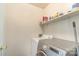 Laundry room with washer, dryer, and shelving for storage at 1314 Frederick St, Shelby, NC 28150