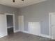 Bedroom with gray walls, wood floors, and white doors at 1720 S Main St, Salisbury, NC 28144