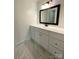 Clean bathroom, vanity with drawers, and a large mirror at 213 Eastwood Dr, Salisbury, NC 28146