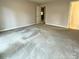 Spacious bedroom with carpet flooring and access to other rooms at 213 Eastwood Dr, Salisbury, NC 28146
