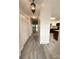 Bright hallway with wood-look floors leading to kitchen at 213 Eastwood Dr, Salisbury, NC 28146