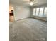 Bright living room featuring hardwood floors and a view into the kitchen at 213 Eastwood Dr, Salisbury, NC 28146
