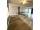 Living room with hardwood floors and view into kitchen at 213 Eastwood Dr, Salisbury, NC 28146