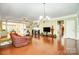 Bright living room featuring hardwood floors and a fireplace at 2221 Hartwell Ln, Fort Mill, SC 29707