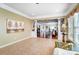 Sunroom with tile floors and views into the living room at 2221 Hartwell Ln, Fort Mill, SC 29707