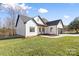 White farmhouse-style home with a two-car garage at 2644 Polo Ln, Maiden, NC 28650