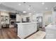 Open concept kitchen with island, white cabinets and stainless steel appliances at 2988 Old Salisbury Concord Rd, Concord, NC 28025