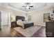 Relaxing main bedroom with dark wood furniture and hardwood floors at 2988 Old Salisbury Concord Rd, Concord, NC 28025