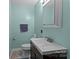 Small bathroom with single sink vanity, toilet, and shower at 325 Fairfield Ct, Mount Gilead, NC 27306