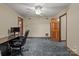 Home office with a desk, chair, and access to another room at 325 Fairfield Ct, Mount Gilead, NC 27306