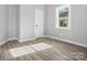 Bedroom with hardwood floors, a window, and neutral walls at 3338 York Hwy, Gastonia, NC 28052