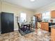 Functional kitchen with wood cabinets, stainless steel appliances, and tile flooring at 423 Park Ave, Pineville, NC 28134