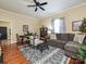 Spacious living room with hardwood floors, comfortable seating, and a dining area at 423 Park Ave, Pineville, NC 28134