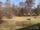 Large backyard with wooded area and garden at 4966 Lineberger Loop Rd, Denver, NC 28037