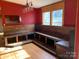 Built-in wooden bench seating in dining area at 4966 Lineberger Loop Rd, Denver, NC 28037