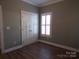 Empty bedroom with white closet doors and plantation shutters at 505 2Nd Street Ne Pl # F-1, Conover, NC 28613