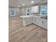 Modern kitchen with island and white cabinets at 713 Broad St, Kannapolis, NC 28081