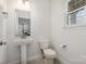 Convenient powder room with pedestal sink and toilet at 717 Cherry Hills Pl, Rock Hill, SC 29730