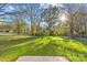 Spacious backyard with lush green grass and mature trees at 934 Log Cabin Dr, Gastonia, NC 28054