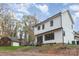 Two story home with white siding and black trim, side view at 1902 Windlock Dr, Charlotte, NC 28270