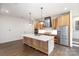 Modern kitchen with large island, stainless steel appliances, and white cabinets at 1902 Windlock Dr, Charlotte, NC 28270