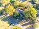 Aerial view of ranch house nestled among mature trees on a quiet street at 2129 James Ct, Rock Hill, SC 29732