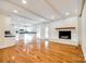 Open Gathering room with hardwood floors, a fireplace, and kitchen access at 2129 James Ct, Rock Hill, SC 29732