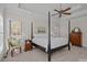 Spacious bedroom with a post bed, dresser, and window seating at 3417 Millstone Creek Rd, Lancaster, SC 29720