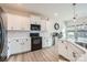 Modern kitchen with white cabinets and black appliances at 3582 Cerelia Ln, Denver, NC 28037