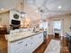 White kitchen cabinets with granite countertops and island at 432 Zelkova St # 38, York, SC 29745