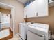 Laundry room with washer, dryer, and upper cabinets at 432 Zelkova St # 38, York, SC 29745