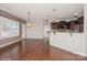 Open kitchen with dark brown cabinets and granite countertops at 5043 Weber Ct, Fort Mill, SC 29715