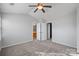 Spacious bedroom with carpeting, and access to bathroom and closet at 6073 Cougar Ln, Charlotte, NC 28269