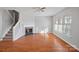 Bright living room featuring hardwood floors and fireplace at 6073 Cougar Ln, Charlotte, NC 28269