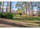 Spacious backyard with mature trees and grassy area at 608 Hanover Dr, Shelby, NC 28150