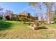 Landscaped backyard with stone picnic table at 608 Hanover Dr, Shelby, NC 28150