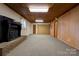 Spacious basement featuring a fireplace and built-in shelving at 608 Hanover Dr, Shelby, NC 28150