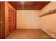 Unfinished basement with built-in shelving and closets at 608 Hanover Dr, Shelby, NC 28150